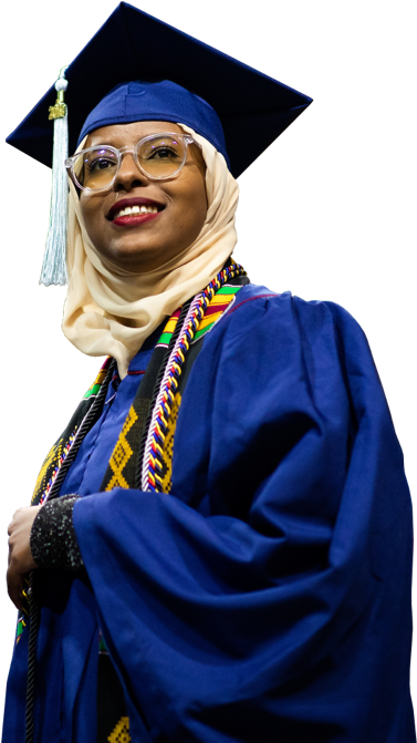 Graduating woman in full robe and cap with a hijab