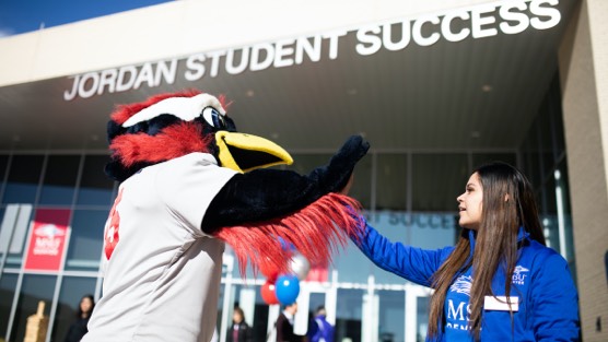 Rowdy high fiving student