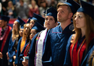 Students in graduation caps and robs at commencement