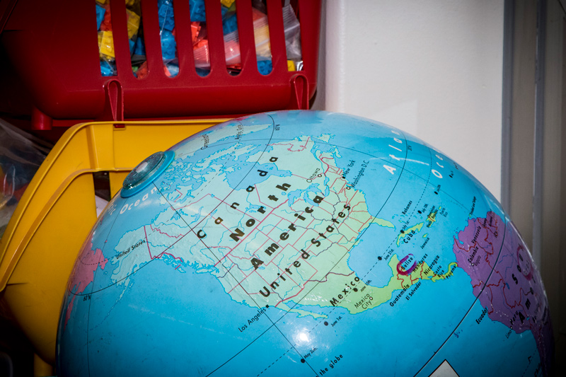 Close up picture of a globe in a classroom.