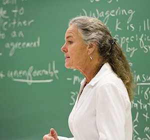 Teacher standing in front of a chalkboard