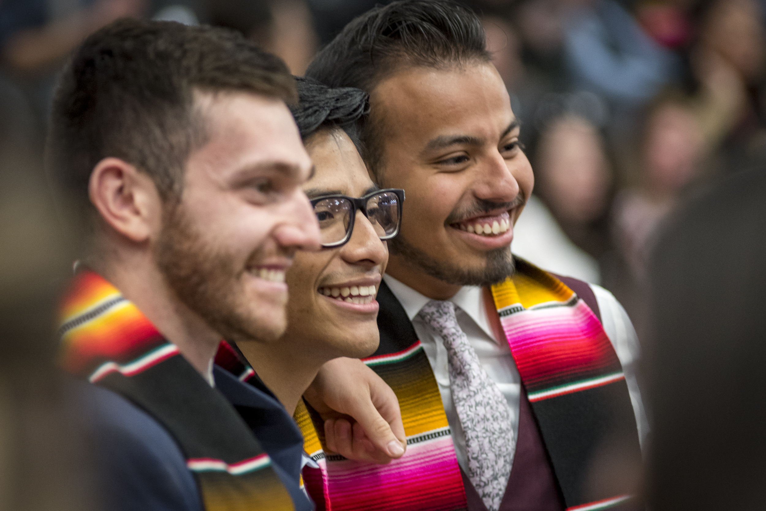 Three graduates smiling at the MSU Denver Latinx Graduation.