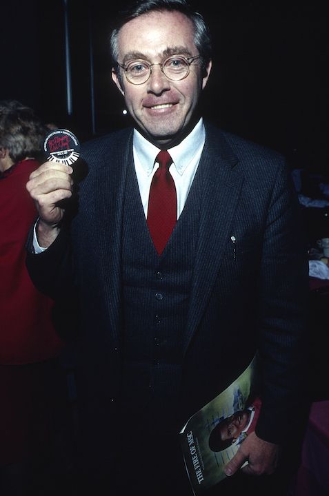 Man holding souvenir from Mark Maslisch's first performance of 