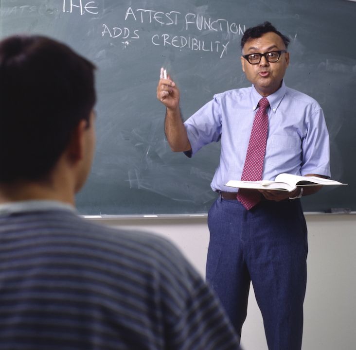 Professor teaching student