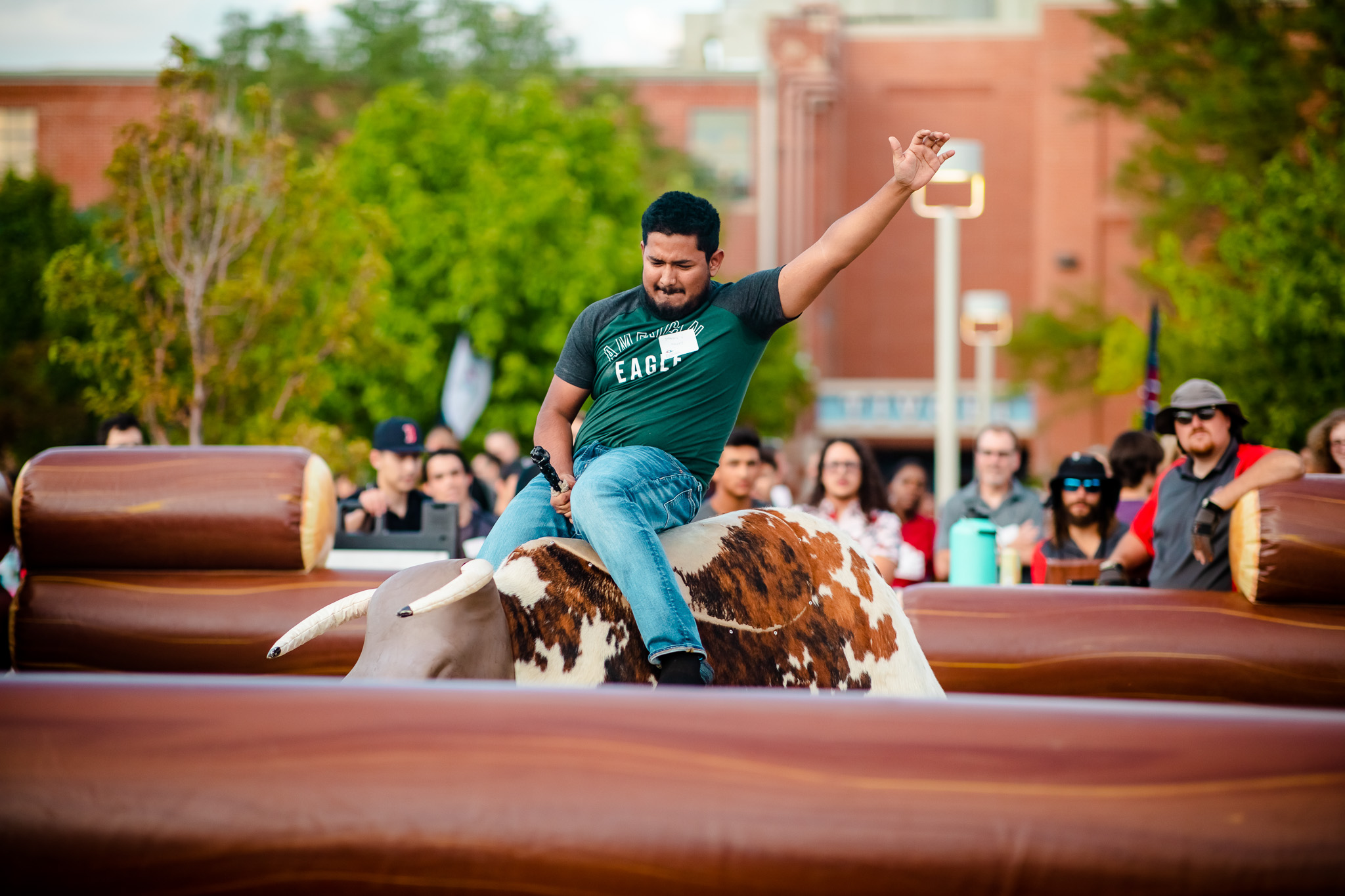 Student on the mechanical bull at convocation