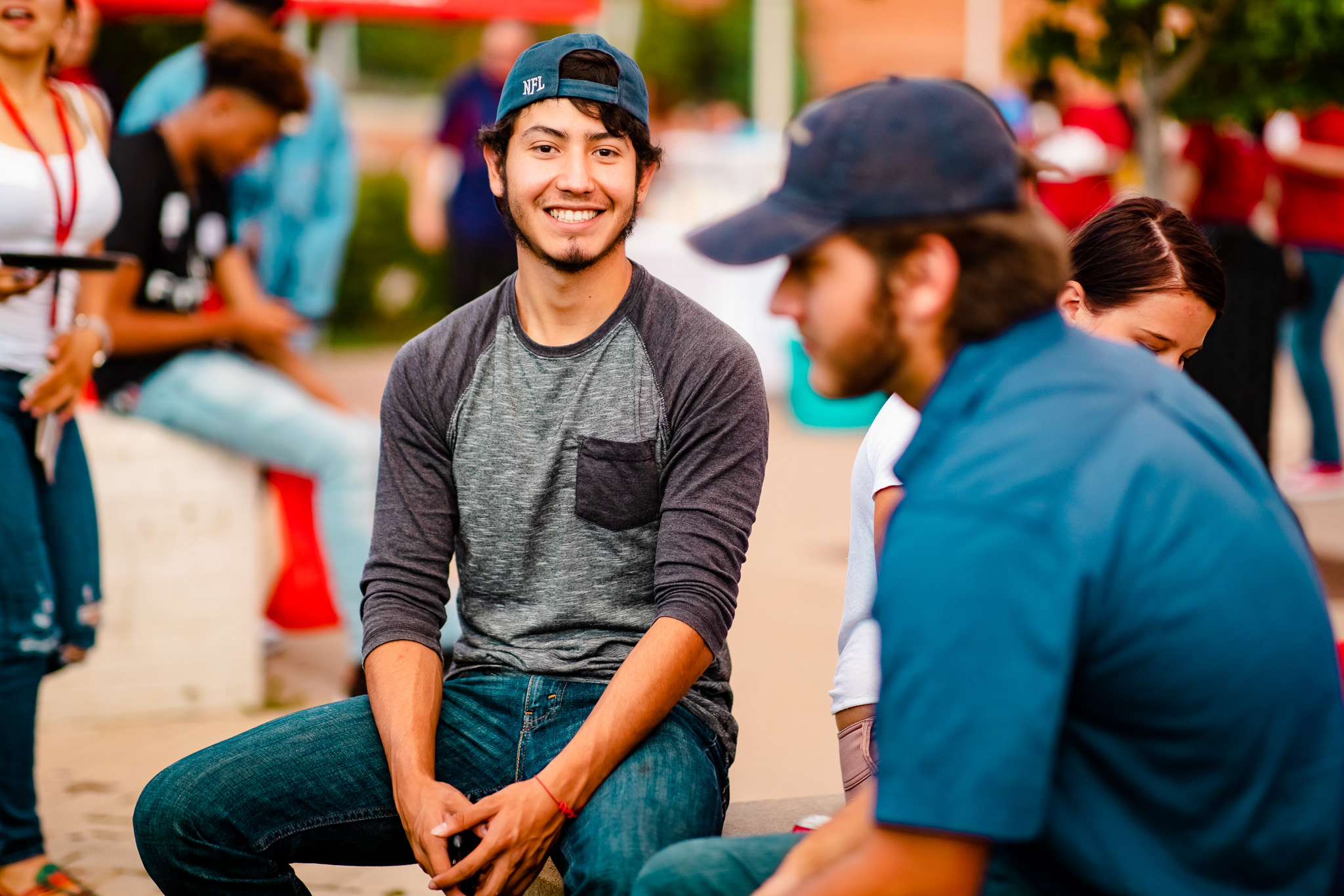 Student at Convocation smiling at the camera