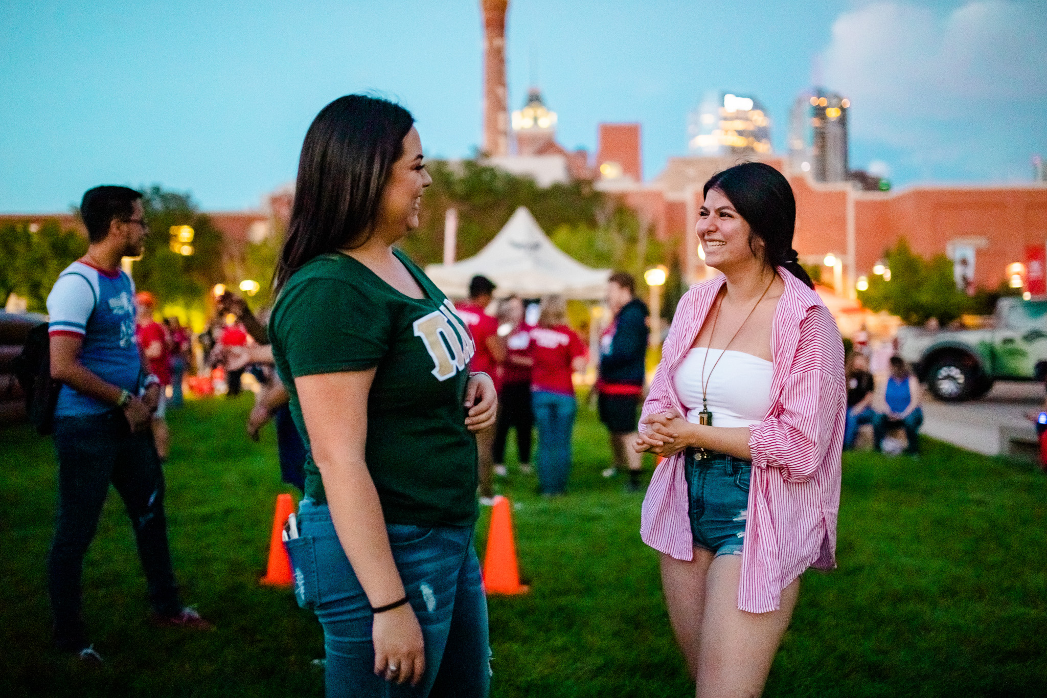 Sorority members smiling at each other during convocation