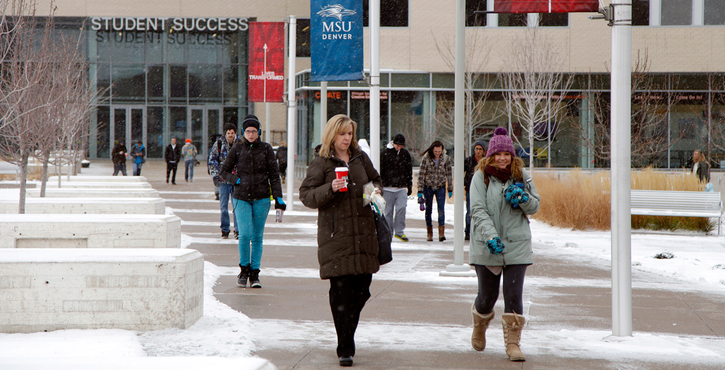 Students walking through Auraria Campus during the winter.