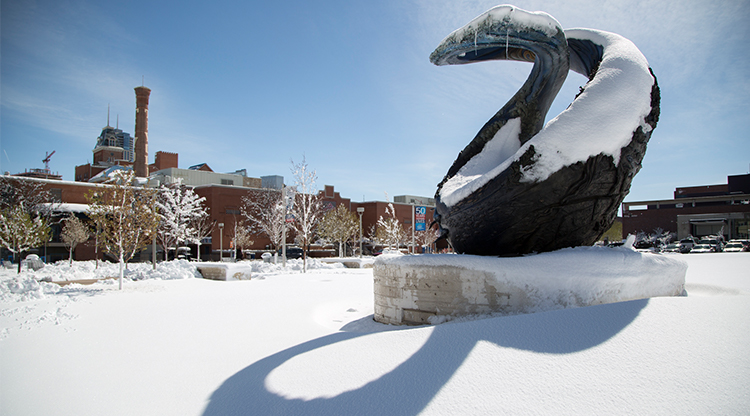 One World One Water sculpture on a snowy day on Auraria Campus.