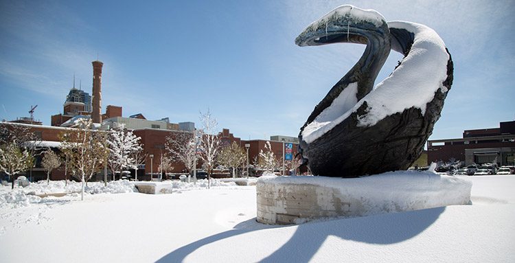 One World One Water sculpture on a snowy day.