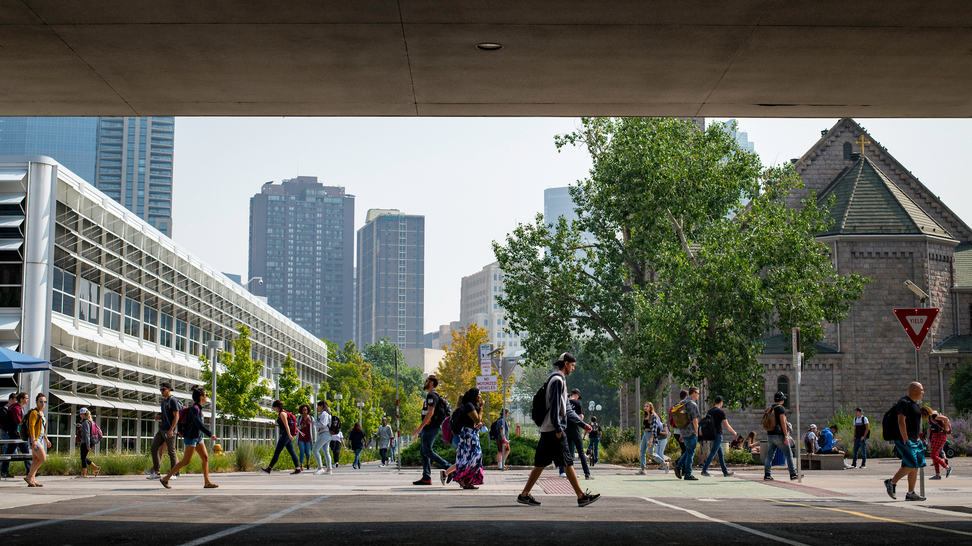 students walking on campus, bridge featured