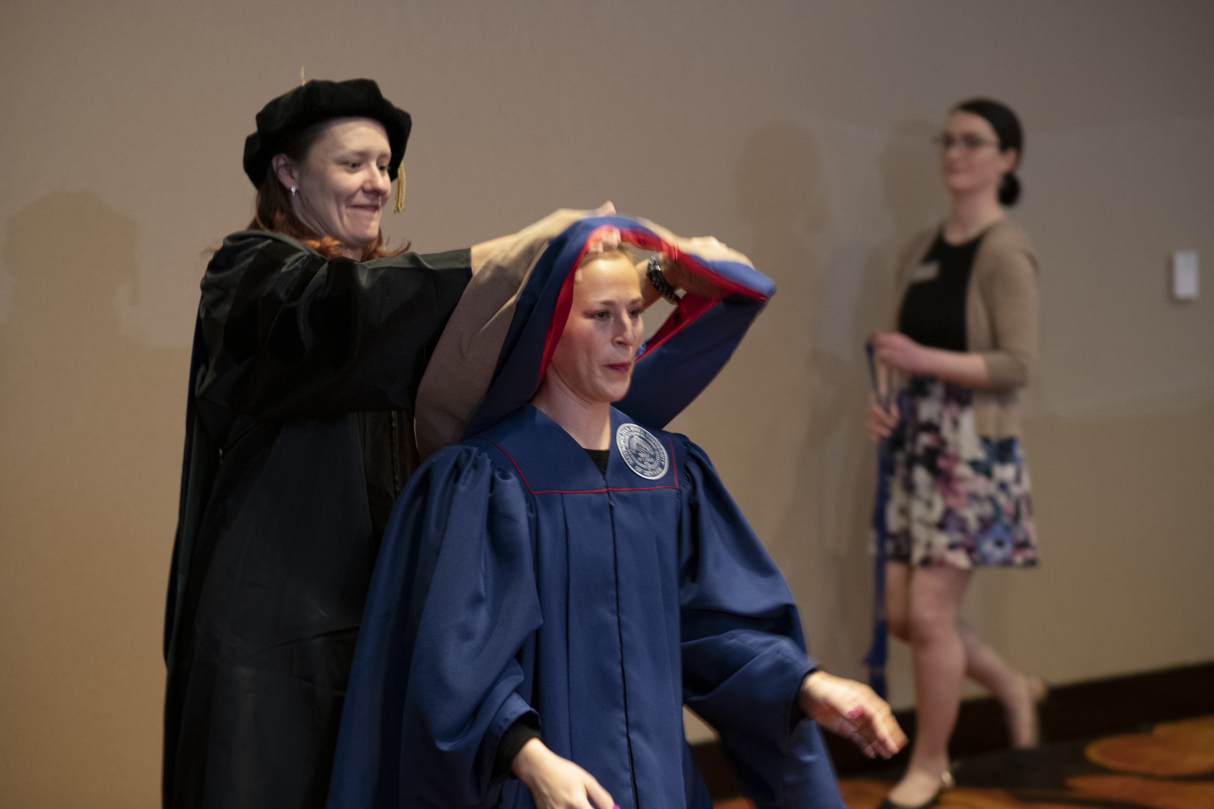 Graduates being hooded at the College of Business Masters Hooding Ceremony.