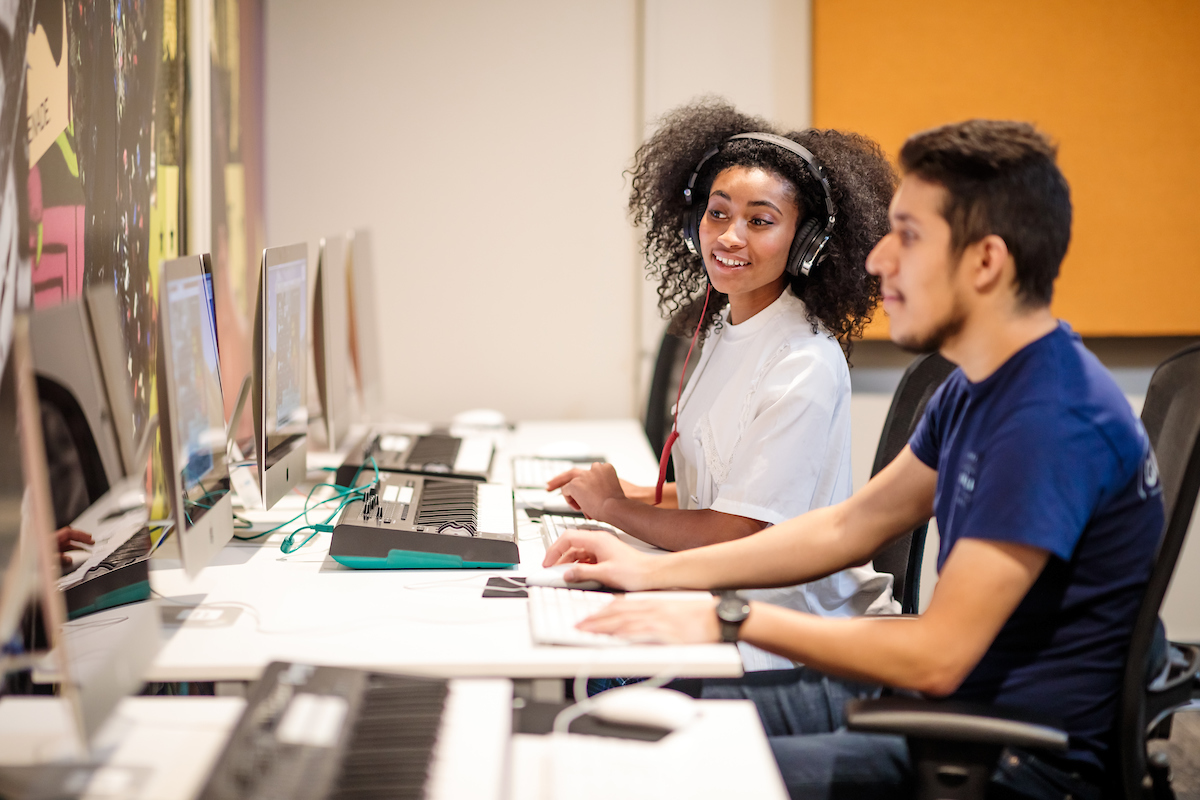 Students studying together at a computer lab.