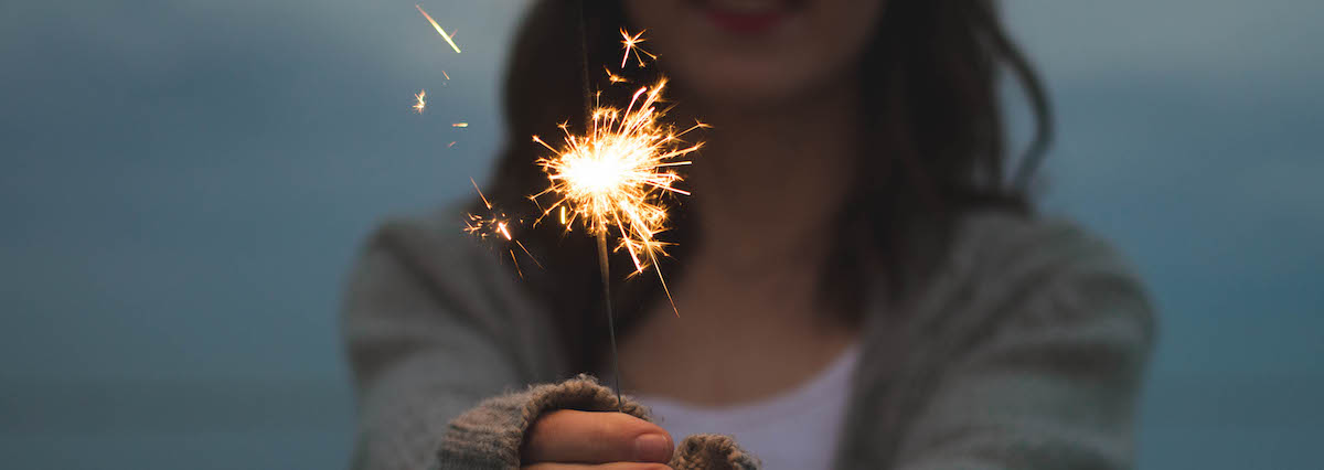 Person holding fire sparkler