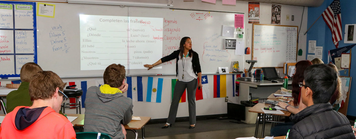 Evelyn Firman teaching in front of her high school Spanish class at Peak to Peak Charter School.
