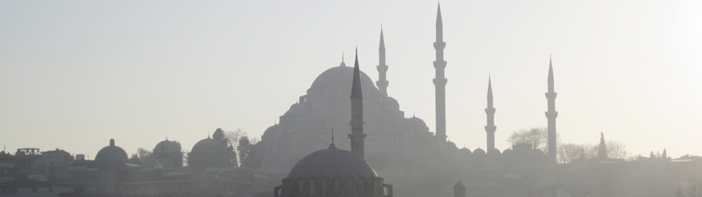 Photograph of hazy structures/buildings in the middle east.