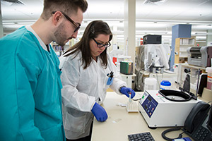 Student being instructed by a staff technologist during his clinical rotation.