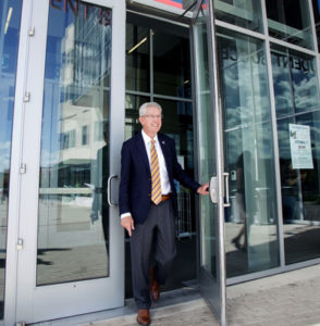 MSU Denver President Stephen Jordan stepping through doors