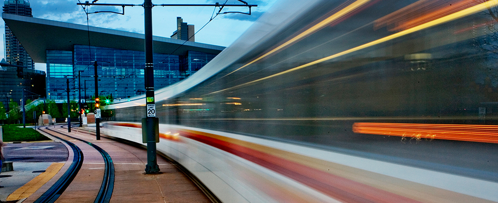 RTD Light Rail train speeding through downtown Denver.