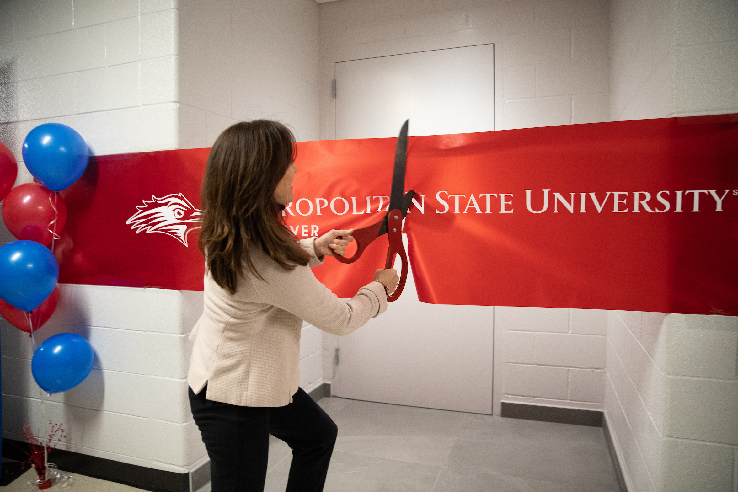 Dr. Davidson cutting the ribbon