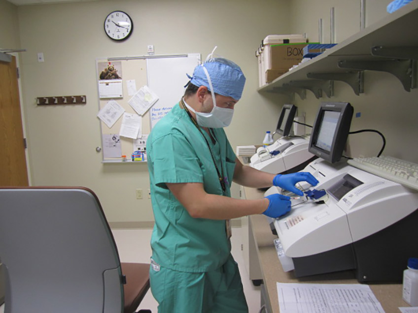 Student training in the OR lab during his clinical rotation