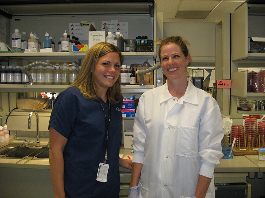 Student and staff technologist in microbiology lab