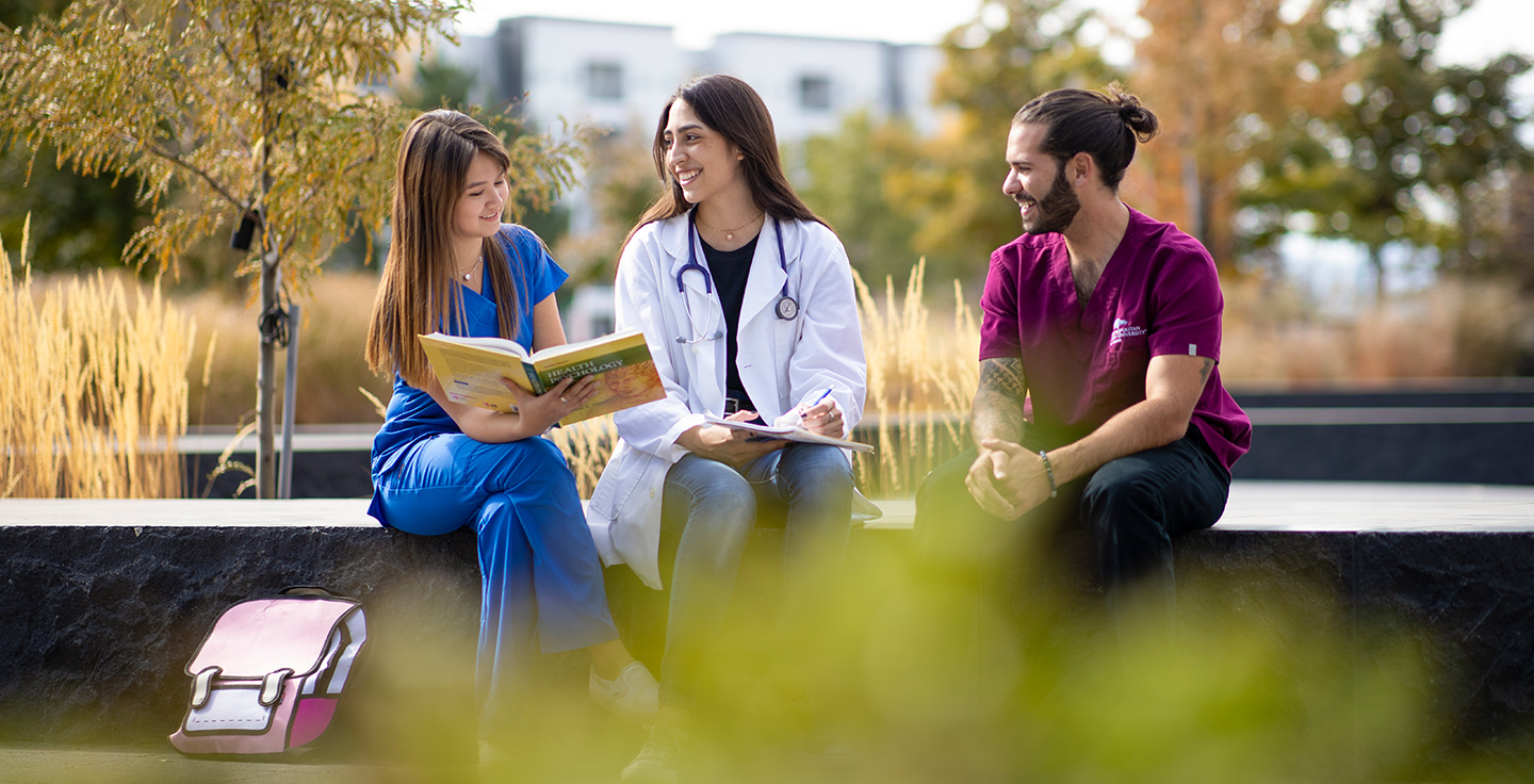 Health Profession students studying outside.