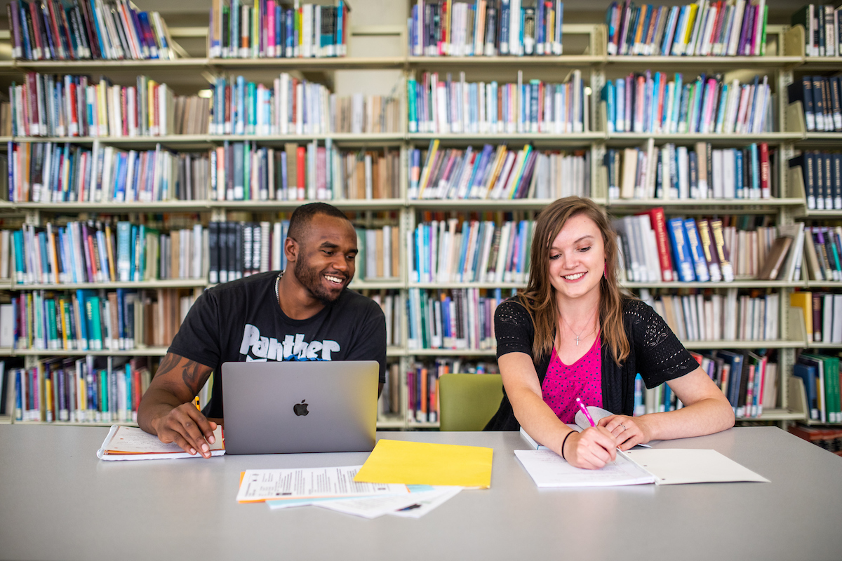 Students share a study space in the Auraria Library.