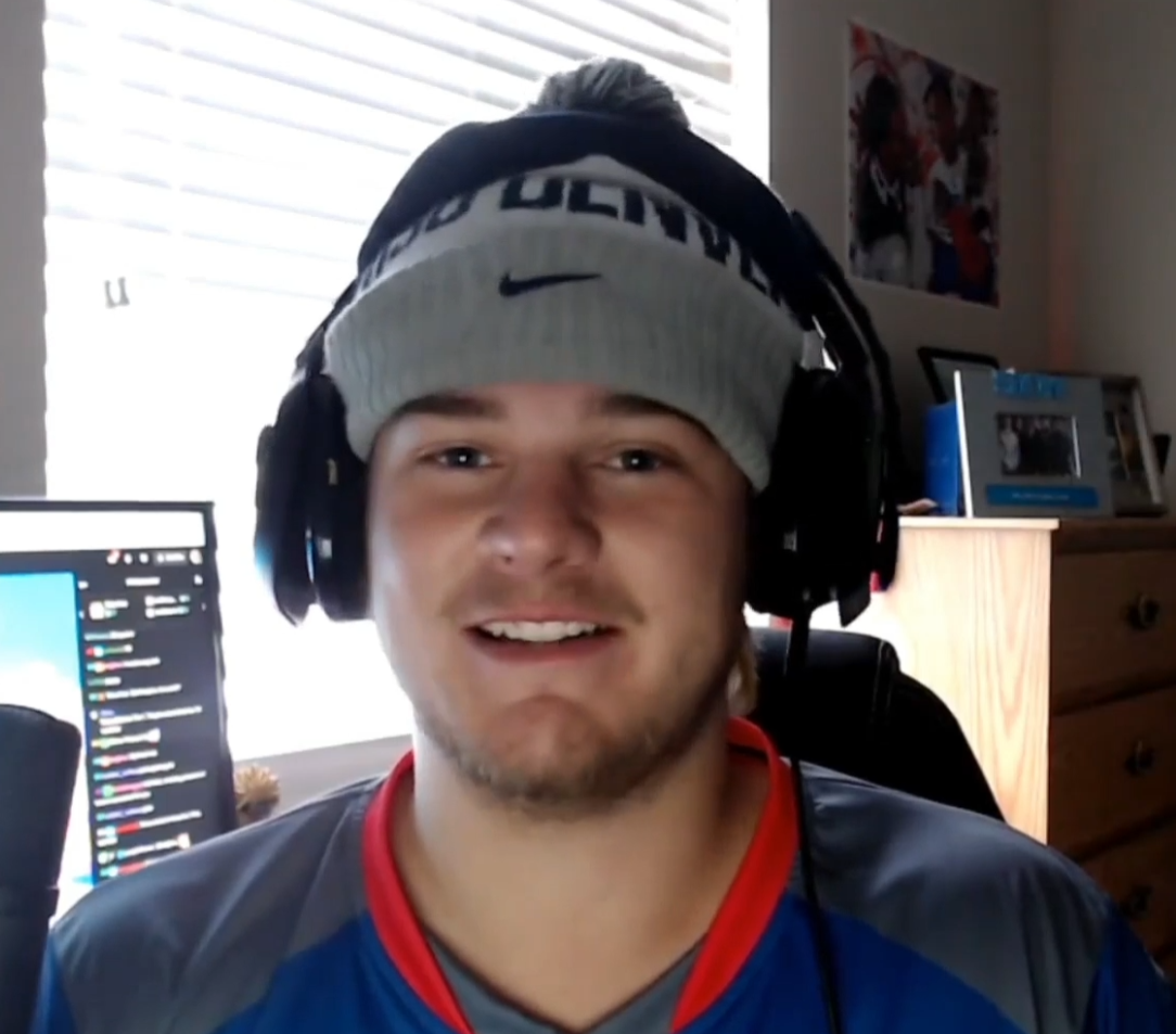 MSU Denvery student Devan Patterson playing Esports with headphones on