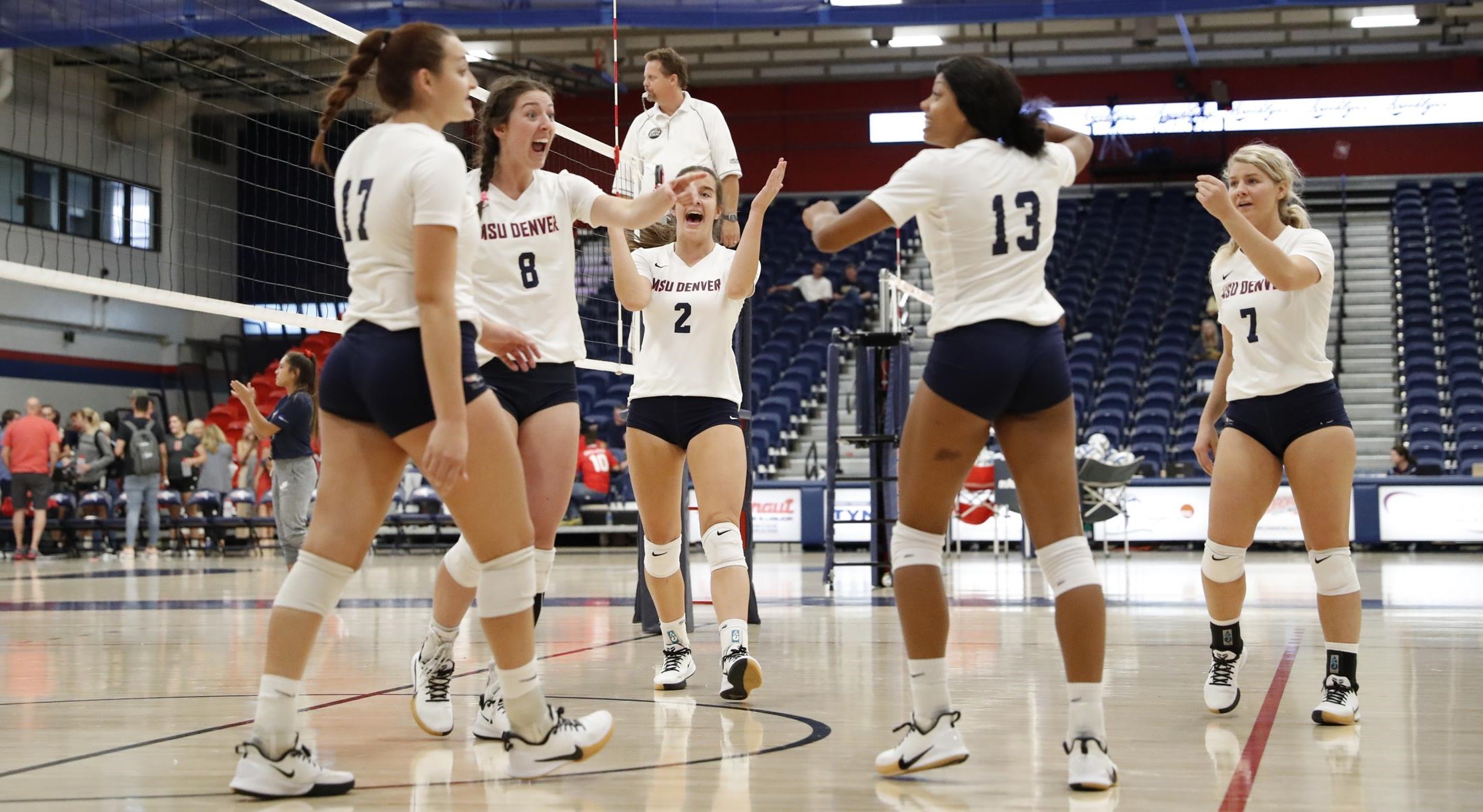 Volleyball players celebrating