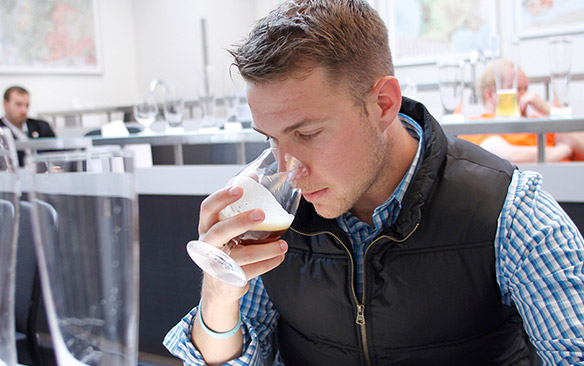 A student samples a beer.