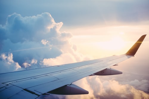 Passenger view ov an airliner wing and the sky.