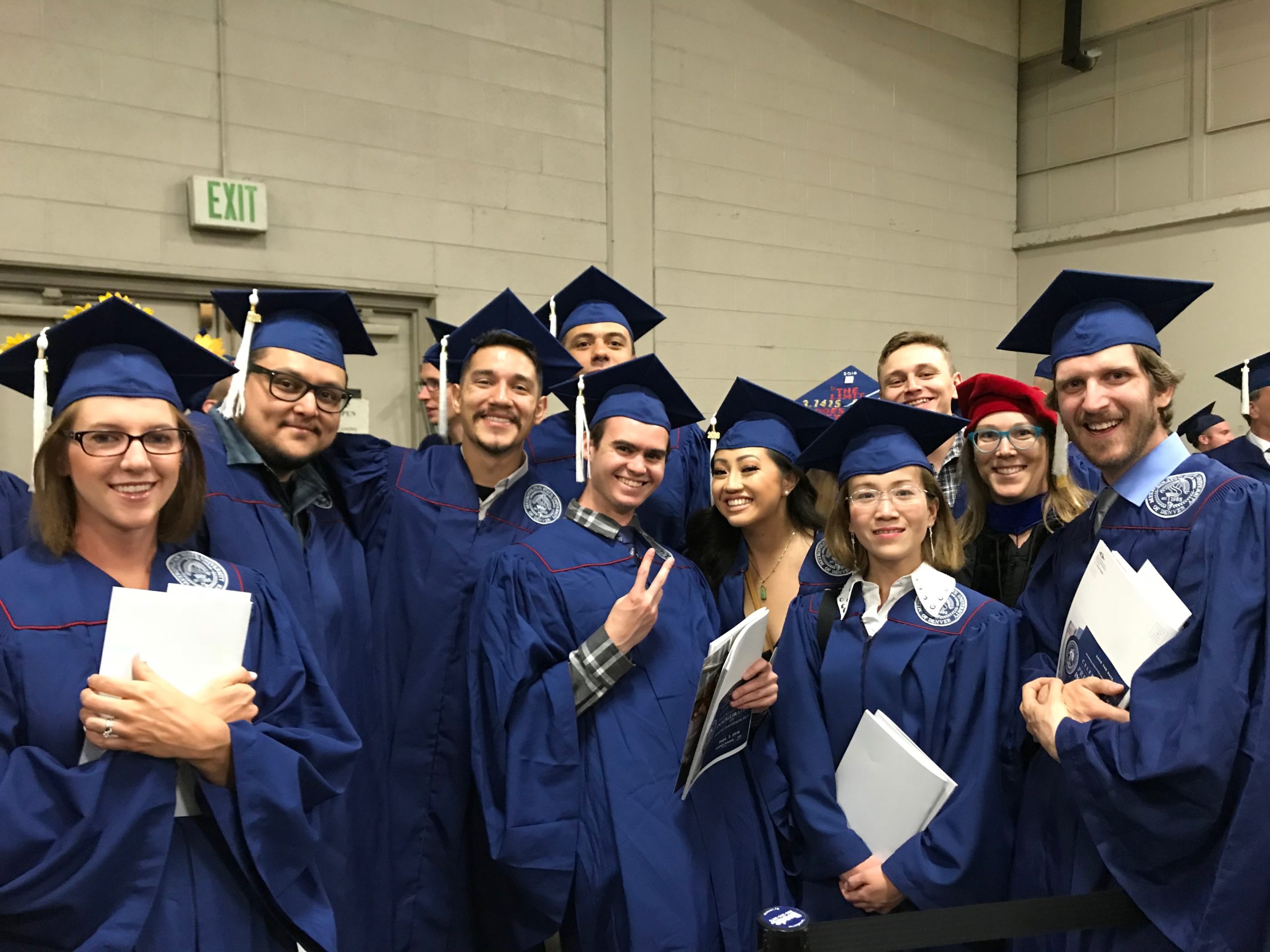 Collection of math & stats faculty in graduation caps and gowns