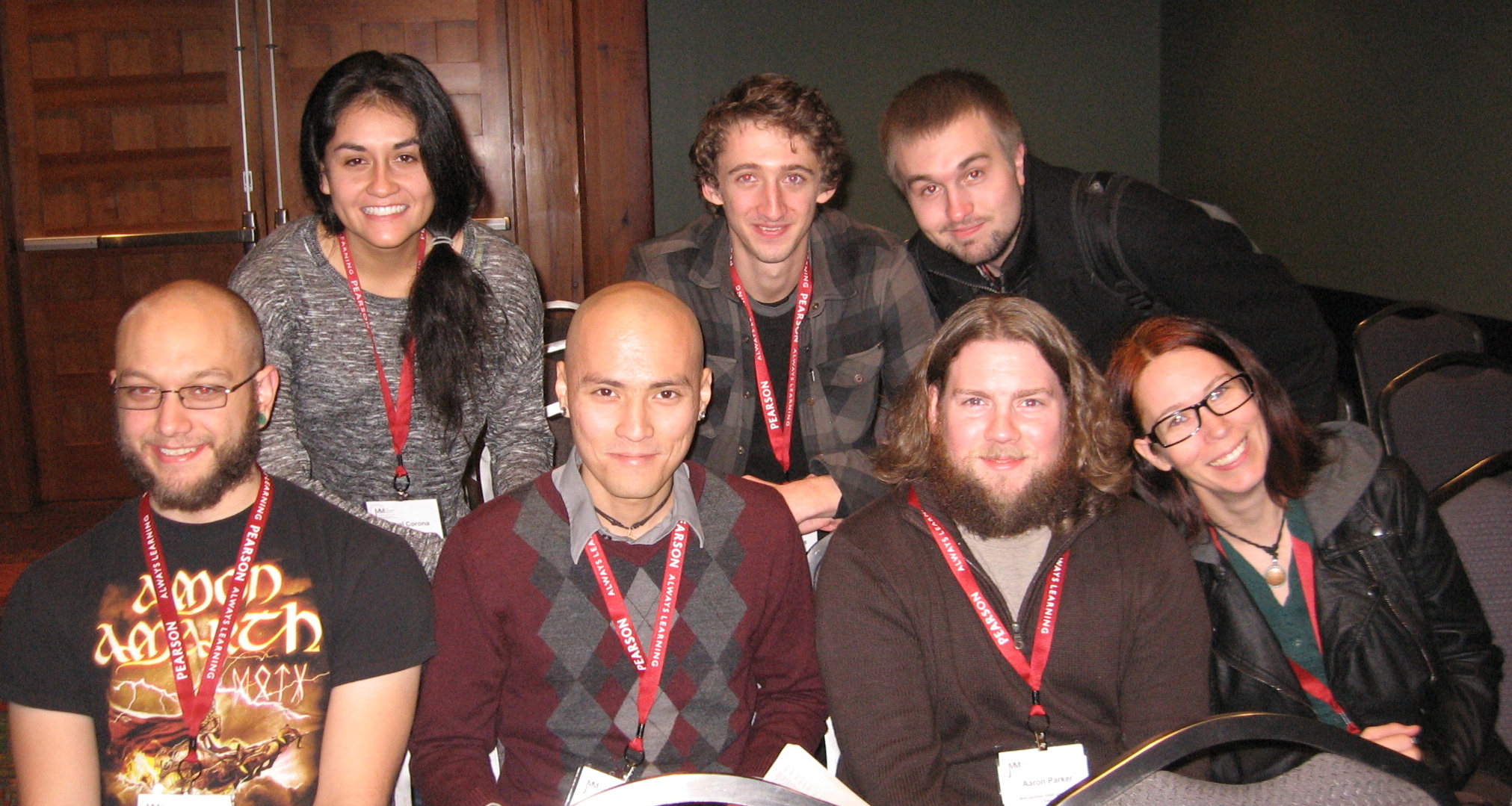 Group of students and faculty members with Pearson lanyards.
