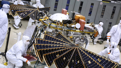 Lockheed Martin technicians working on the InSight Mars rover on the factory floor