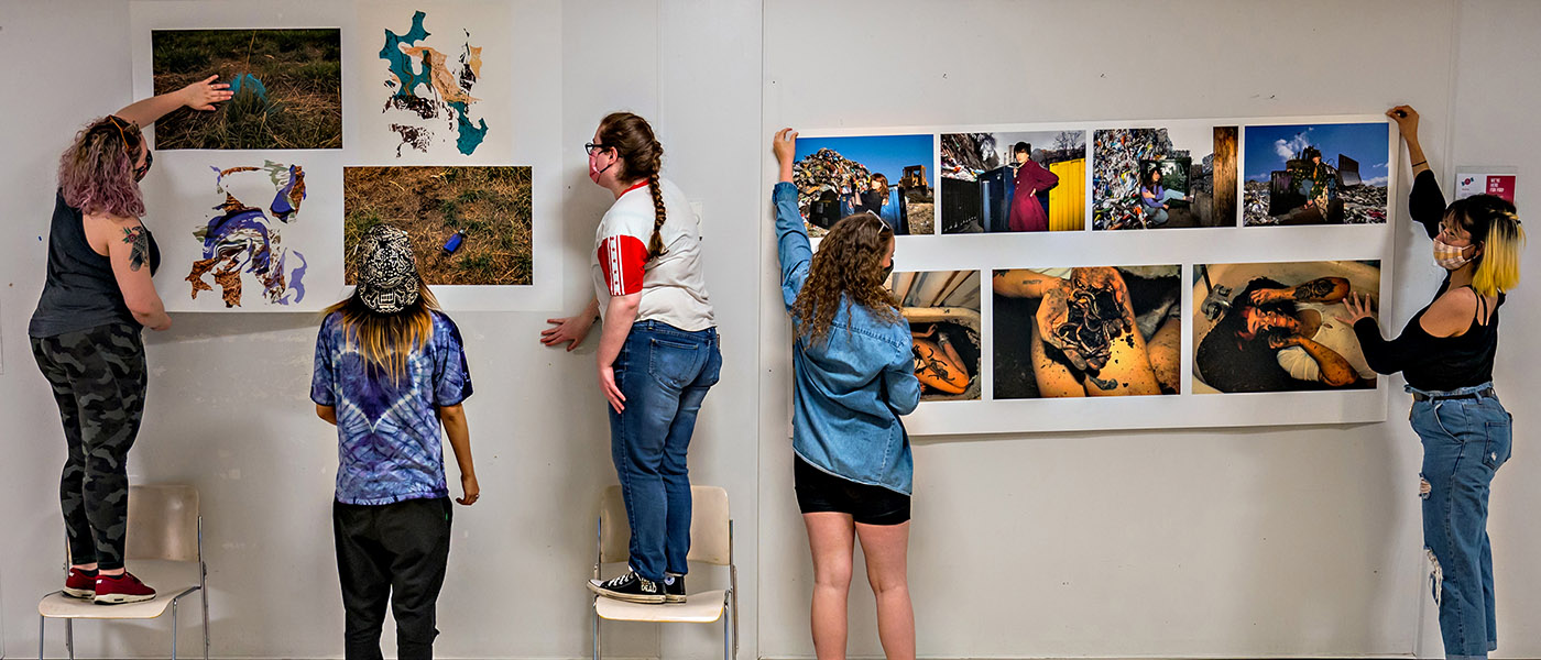 Students hanging images