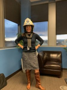 MSU President Dr. Janine Davidson in a fire helmet.
