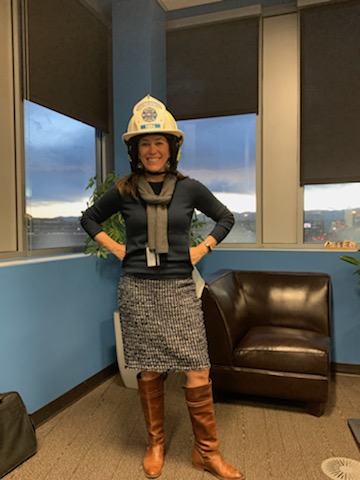 MSU President Dr. Janine Davidson in a fire helmet.