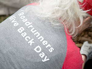 An MSU Denver volunteer wearing a shirt which reads,