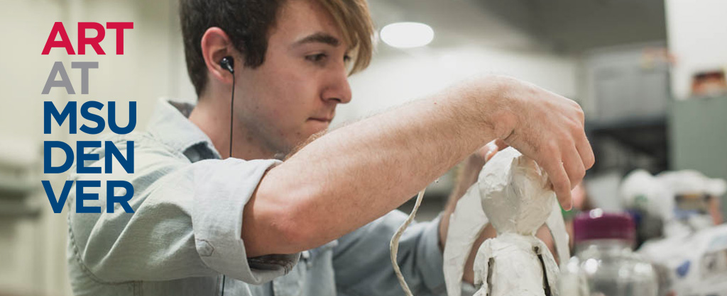 Student with headphones sculpting with clay