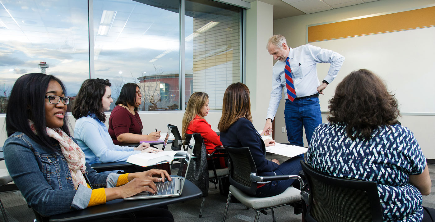 Professor instructing in class setting