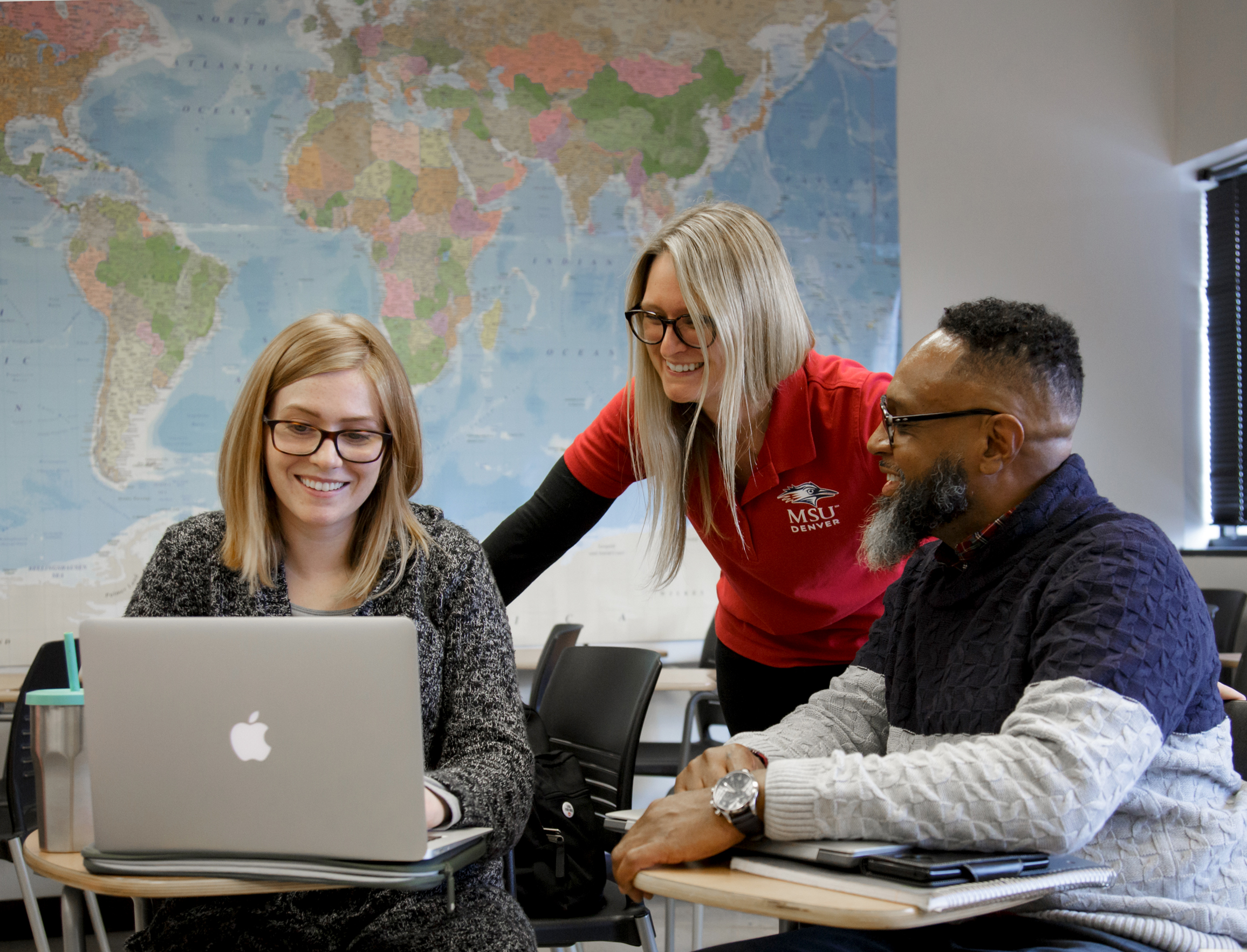 Photo of professor with students in classroom