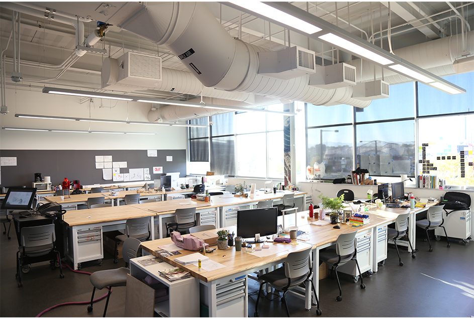 Senior studio with several desks and projects on them
