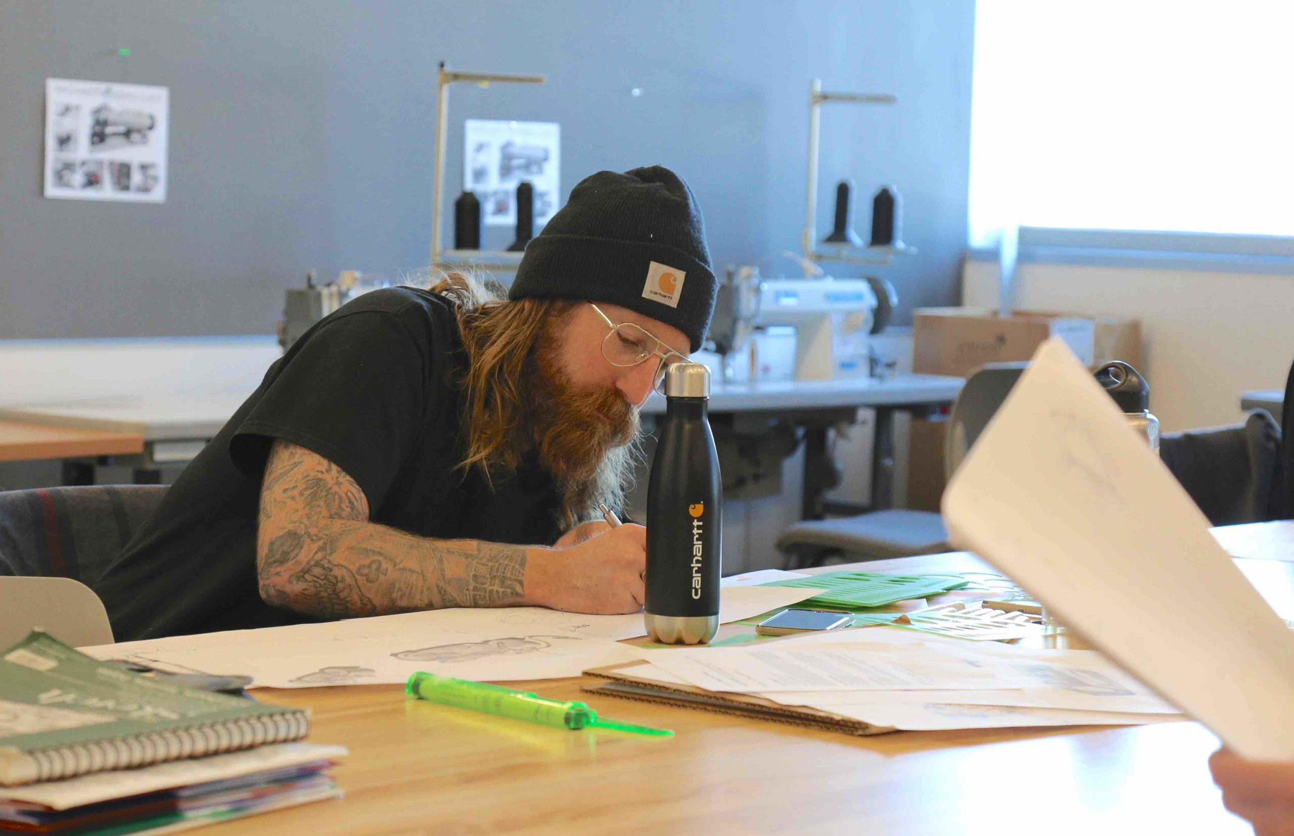 Student drawing on a desk