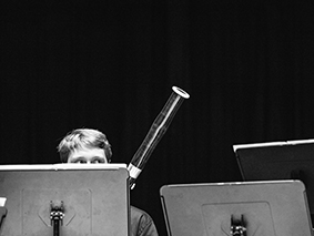 Bassoonist performing behind music stands