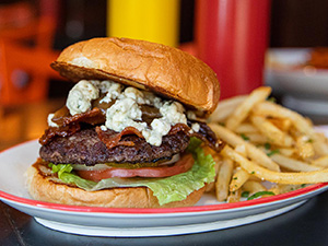 Burger with fries.