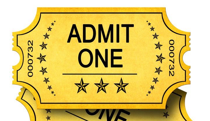 Two yellow show tickets stating Admit One