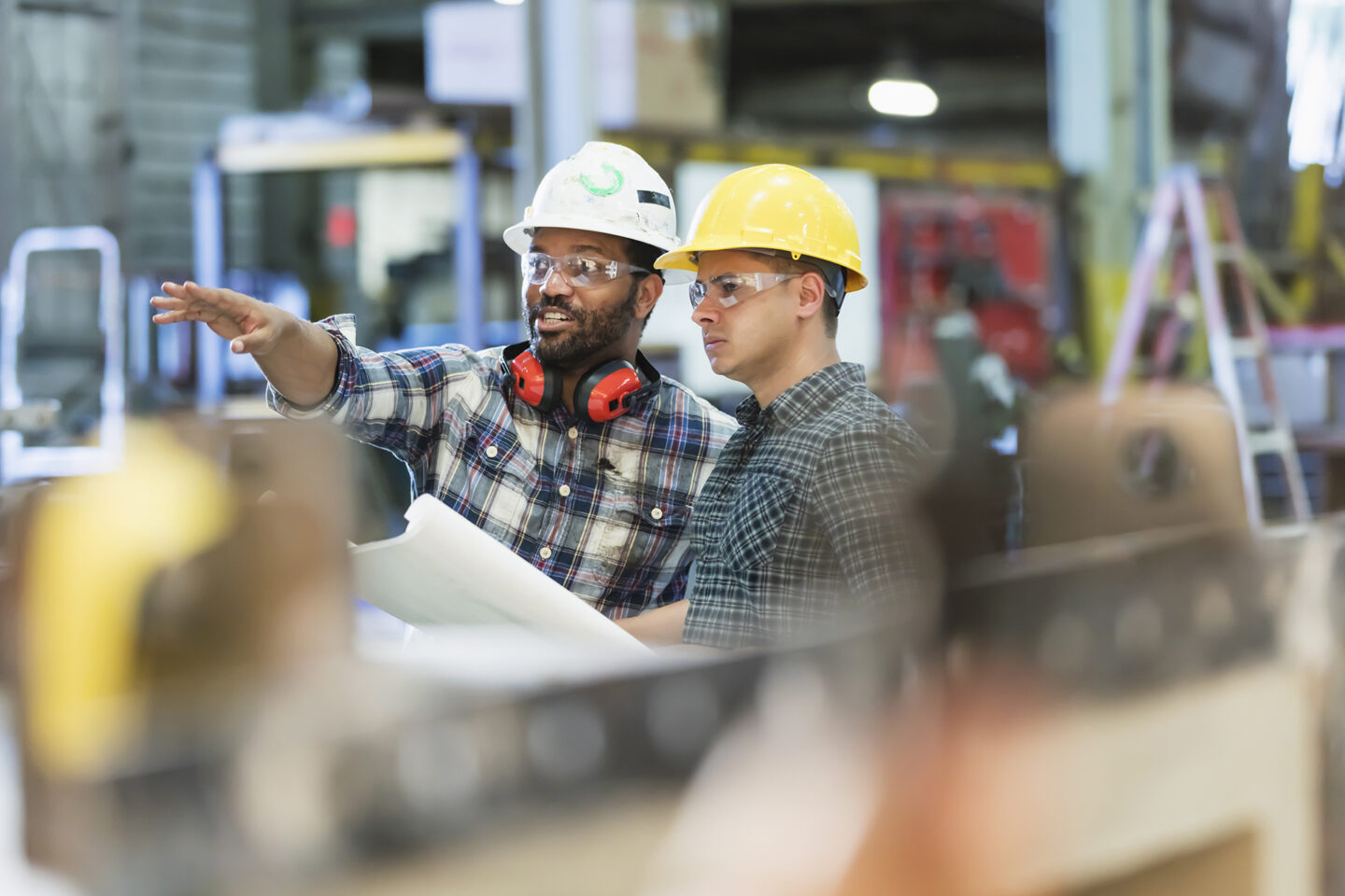 Two construction workers discussing project