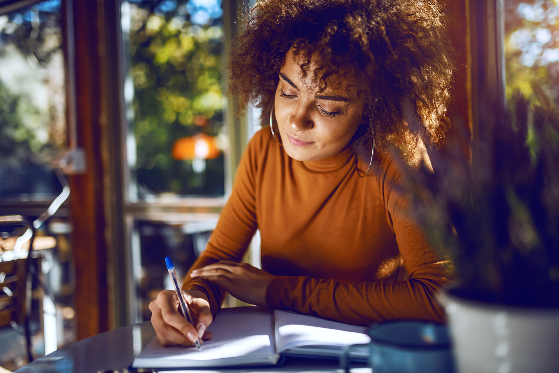 Woman writing on paper