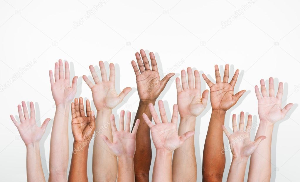 Photo of multiethnic hands in the air